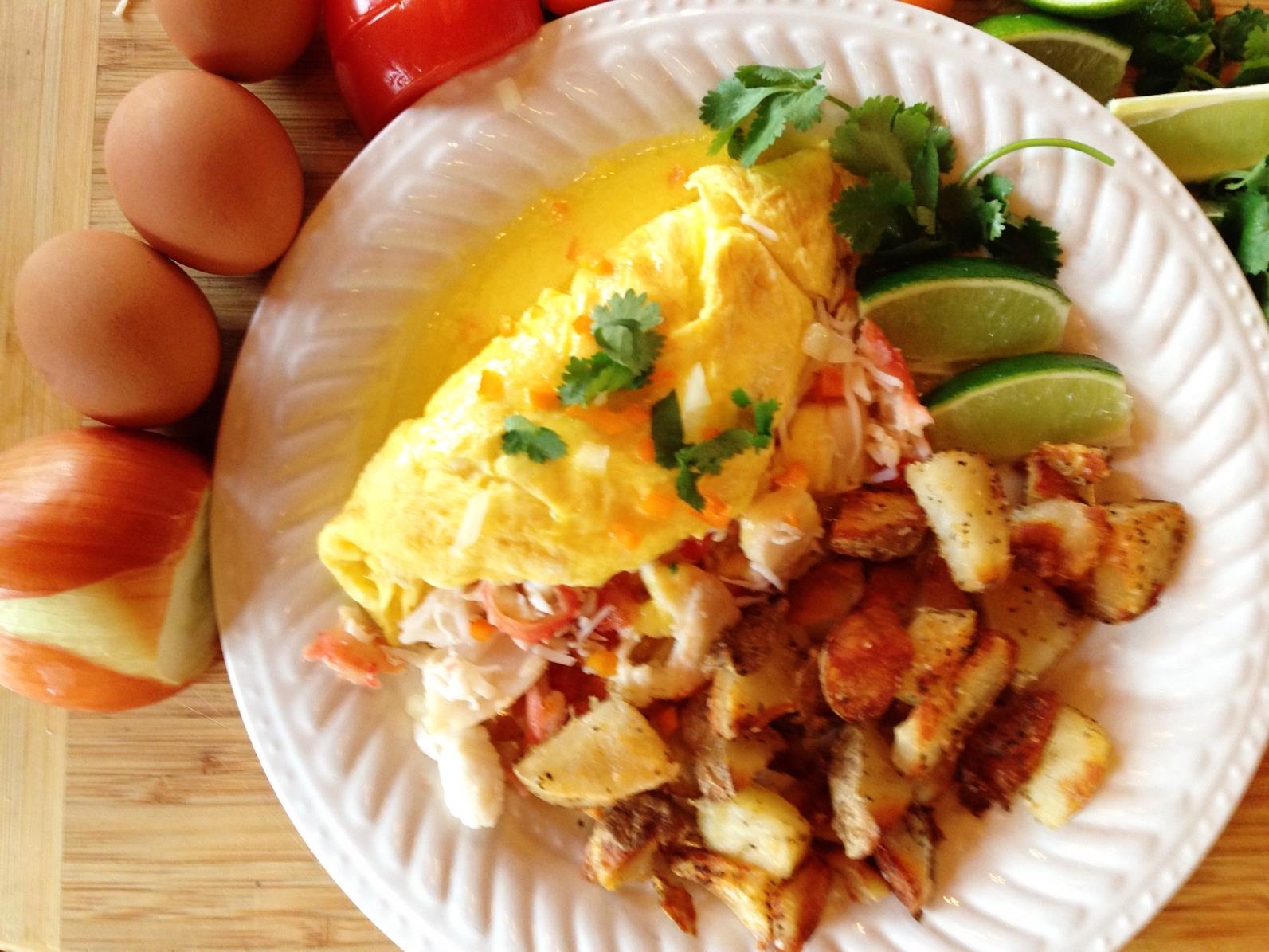 Example of one of our breakfasts on a plate.  Omelete, potatoes, limes, garnish.